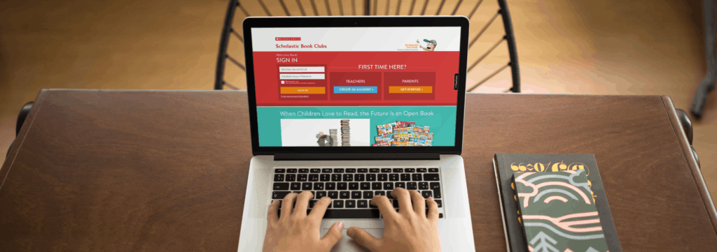 How to get cheap books to build your classroom library 3 student working on a macbook pro at a wooden desk mockup a11785 cheap books for the classroom