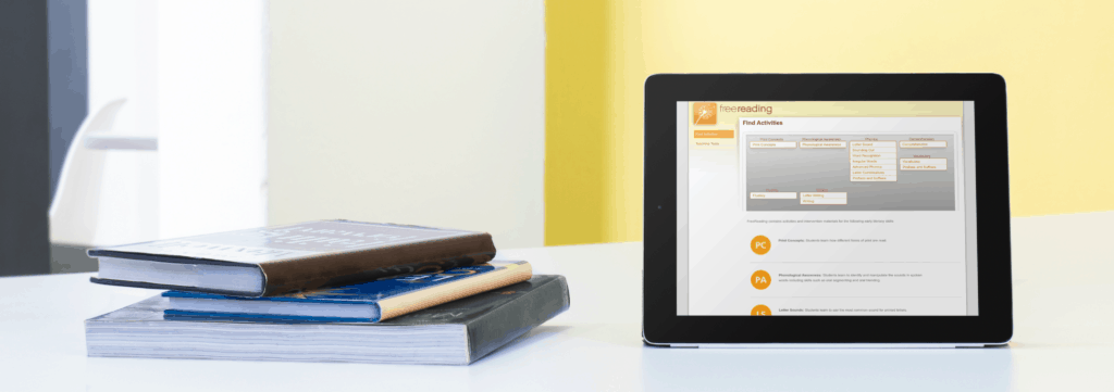 10 No-Cost Reading Intervention Programs -Free Websites with Lessons and Tools 4 mockup template of an ipad standing on a table in a classroom a9481 free reading intervention, websites for free reading intervention
