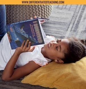 Girl Reading I Survived the Sinking of the Titanic laying on the floor