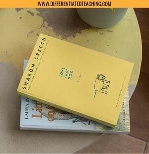 Table with Love that Dog and Little House on the Prairie Stacked on it
